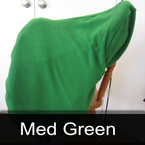 A green saddle cover is sitting on a wooden chair