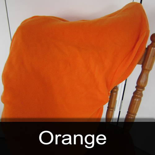 An orange blanket is sitting on a wooden chair