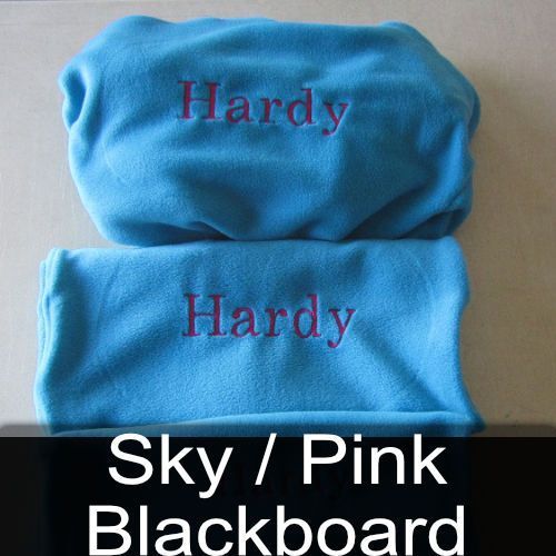 A blue blanket with the name hardy embroidered on it