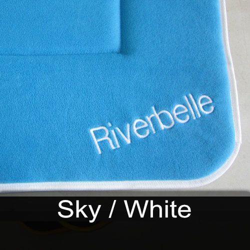 A blue towel with the name riverbelle embroidered on it