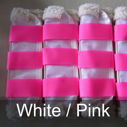 A row of white and pink boots with pink straps