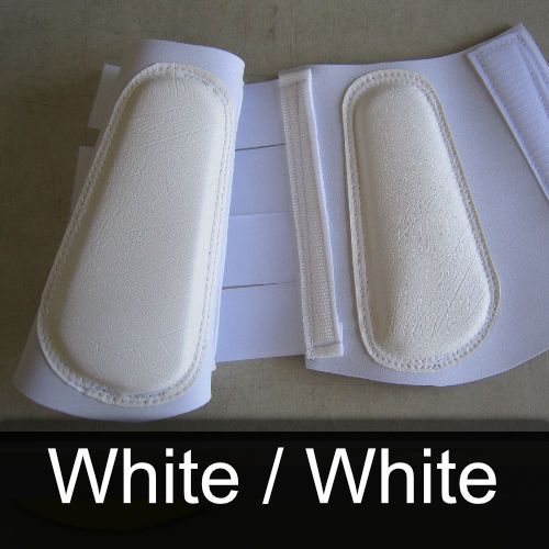 A pair of white boots with the words white / white below them