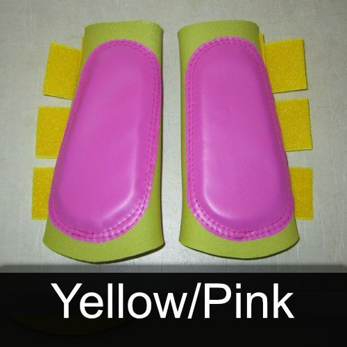 A pair of yellow and pink boots with yellow straps