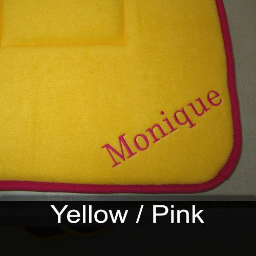 A yellow towel with the name monique embroidered on it