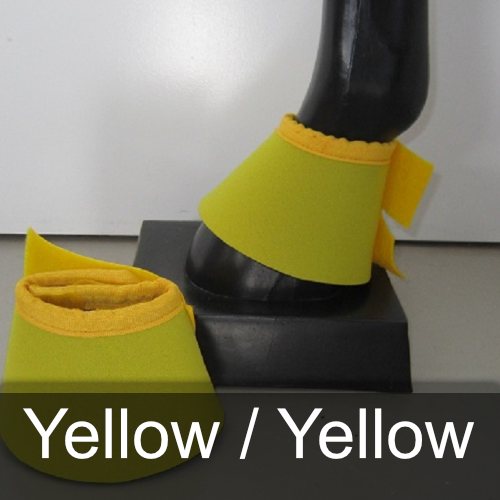 A pair of yellow boots on a black mannequin