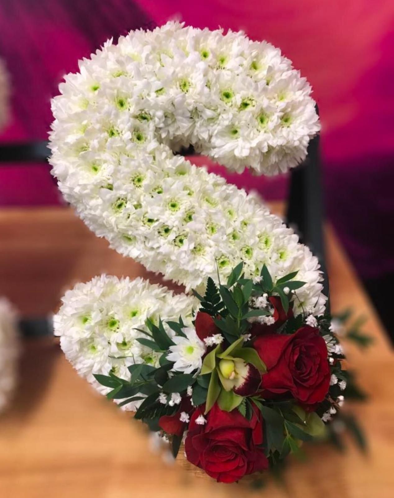 Floral arrangement shaped like a white