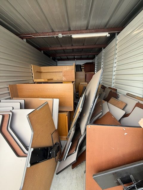 A warehouse filled with lots of wooden pieces