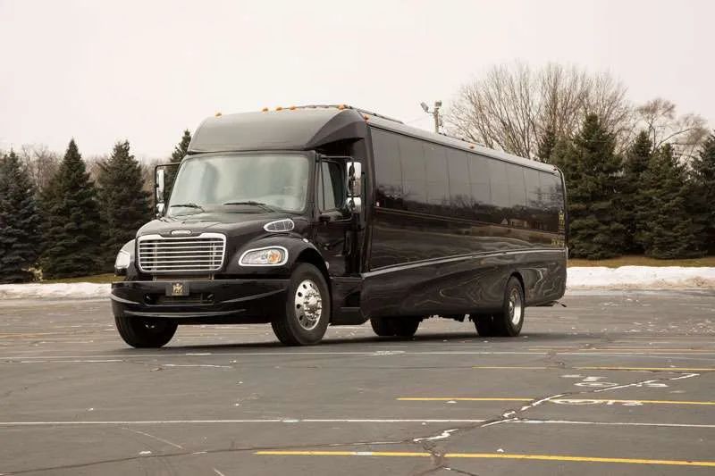 A black van is parked in a parking lot.