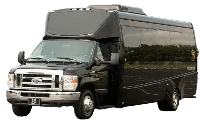 A black ford van is parked in a parking lot.