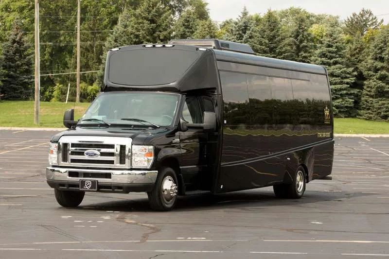 A black van is parked in a parking lot.