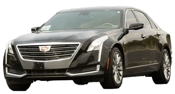 A black cadillac is sitting on a white background.
