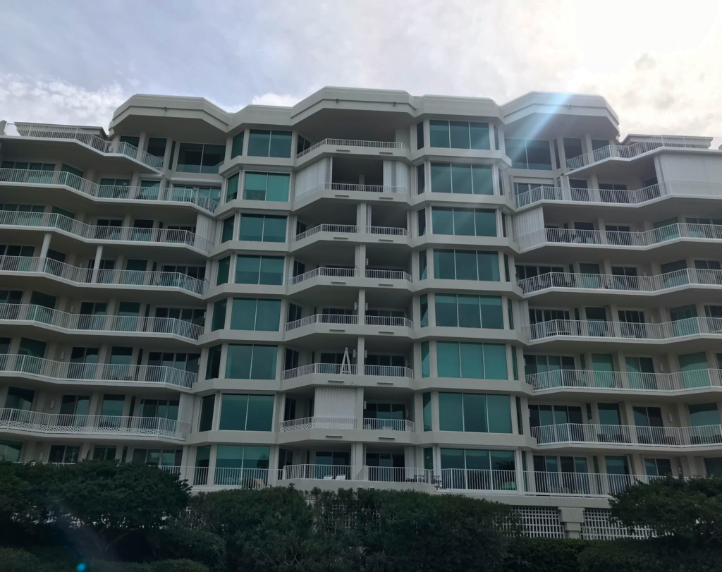 A large building with a lot of windows and balconies.