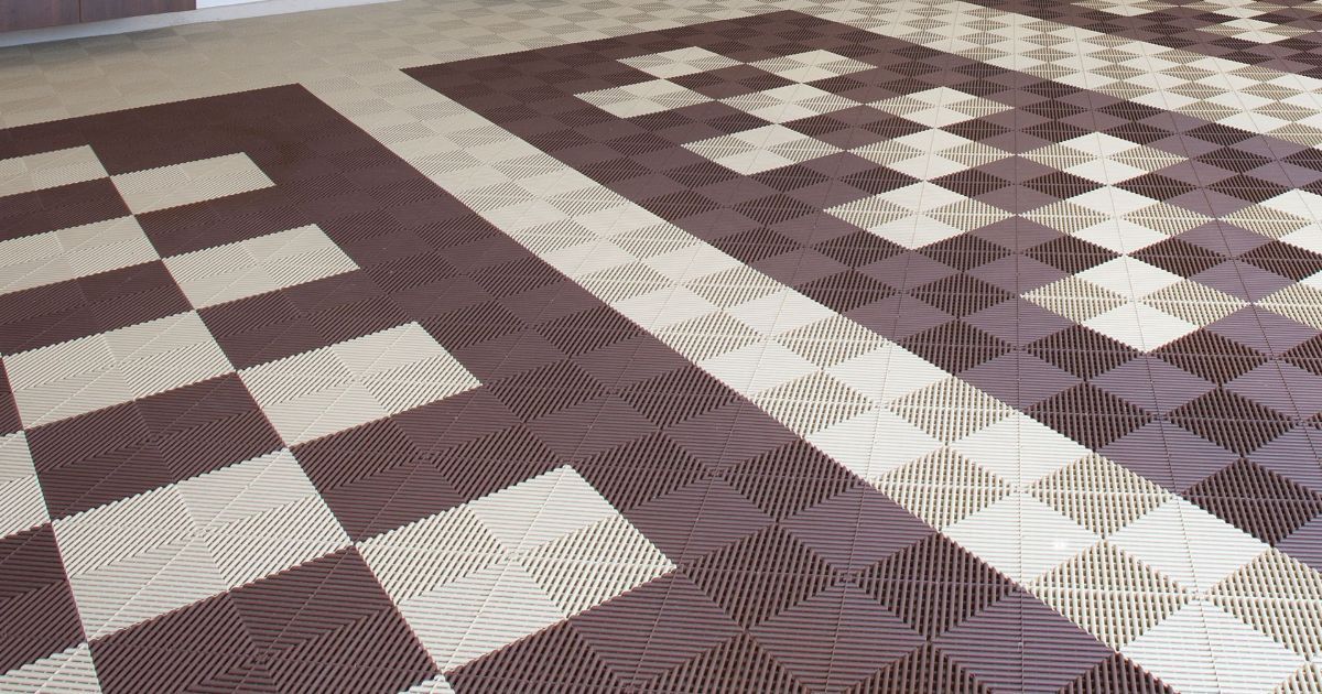 Brown and cream patterned textile with geometric block design.