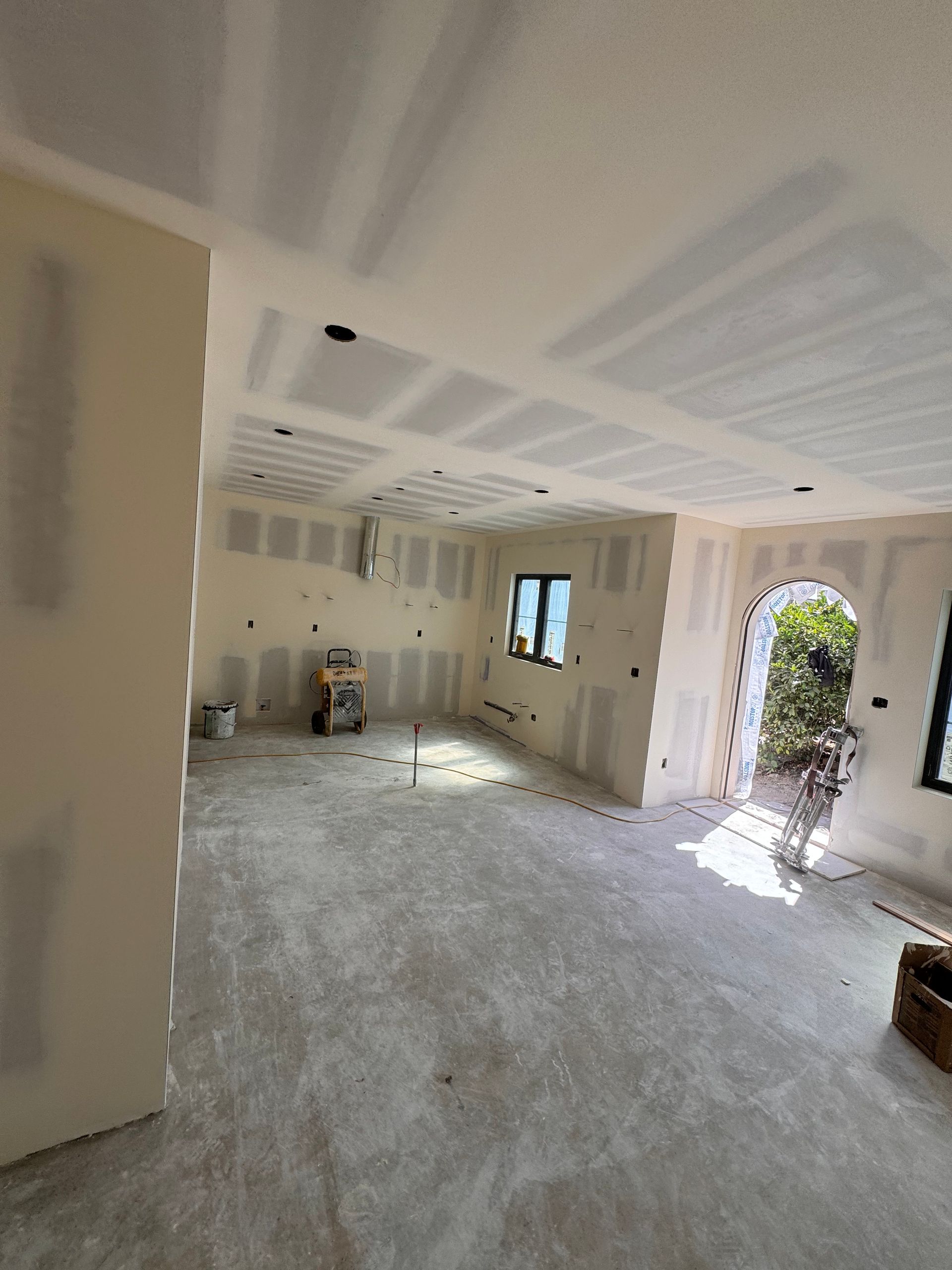 A large room with a lot of drywall on the walls and ceiling.