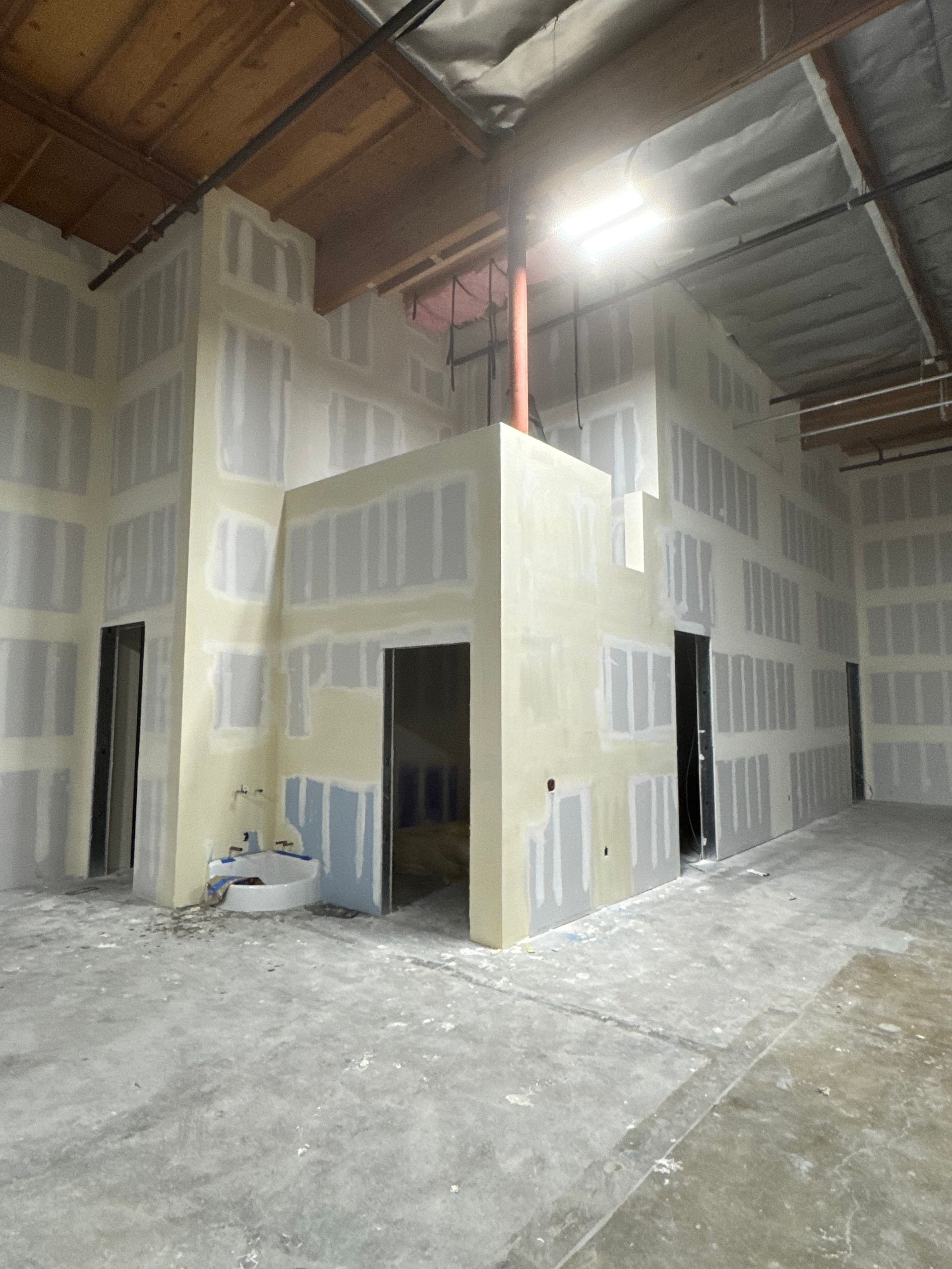 A large room with a lot of drywall on the walls