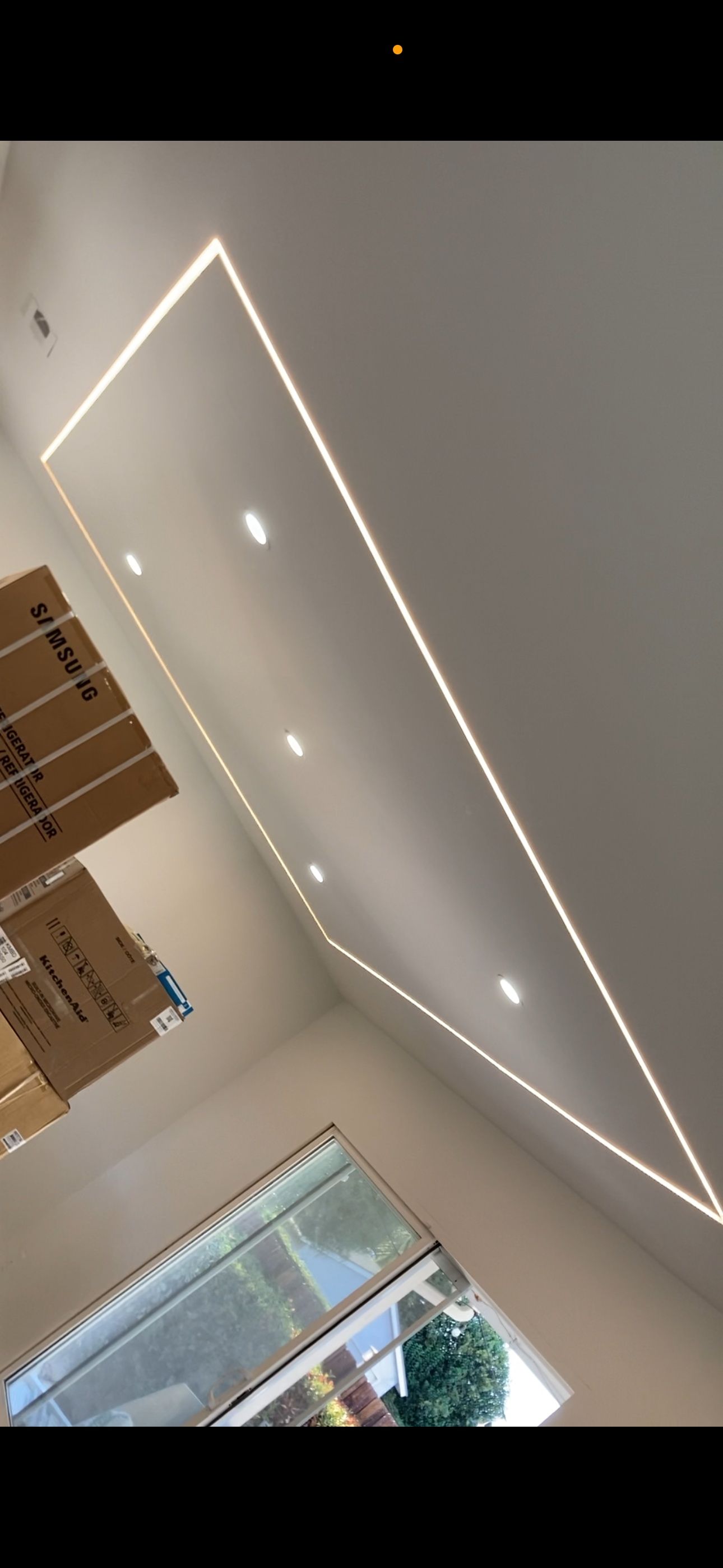 A room with a ceiling that has a lot of lights on it.