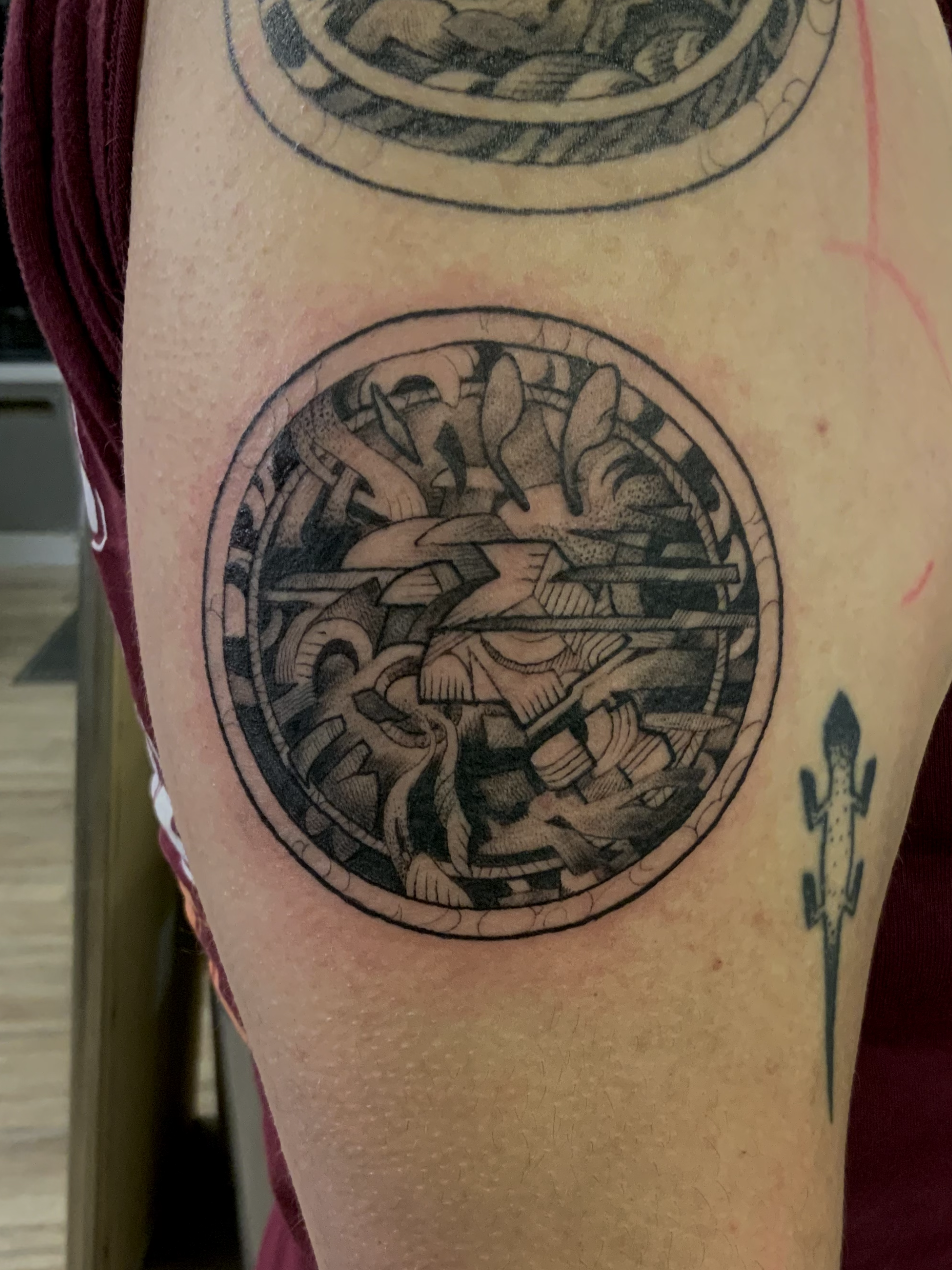 A person has a tattoo of a sandwich on their side.