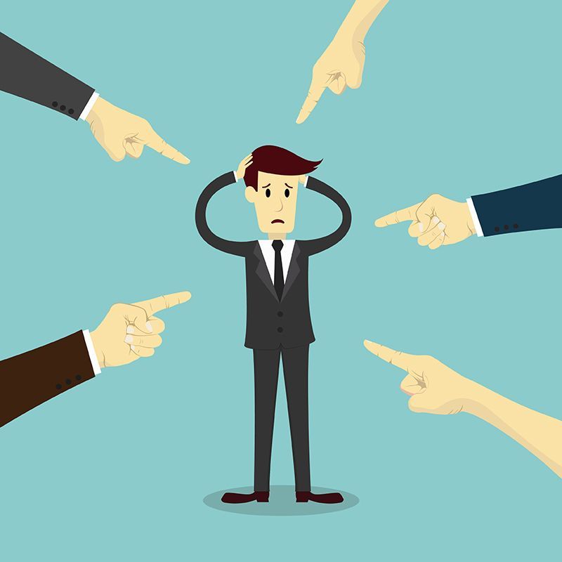 who's to blame? people pointing fingers aa man in a suit