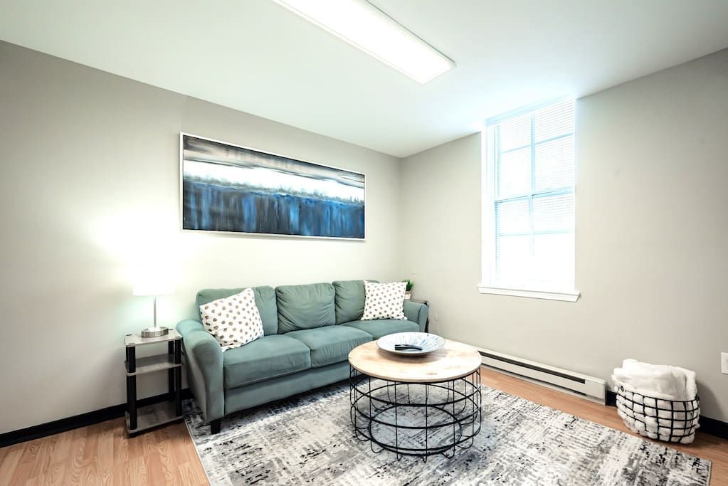 There is a couch and a coffee table in the living room.