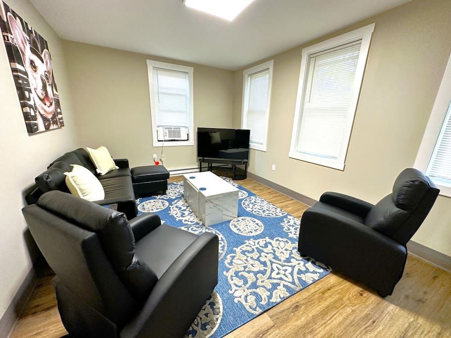 A living room filled with furniture and a flat screen tv.