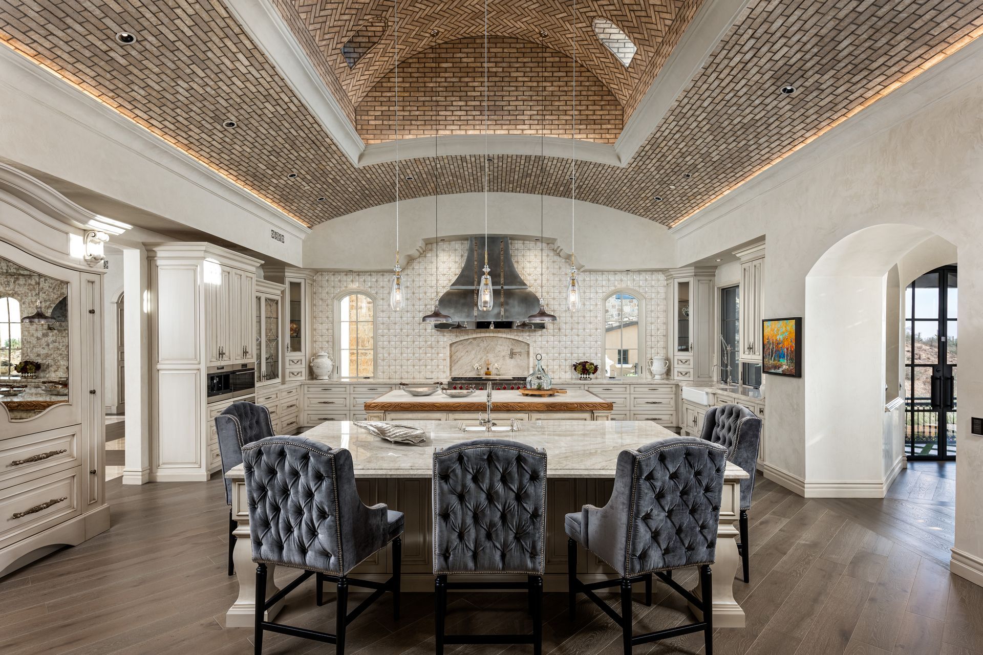 There is a large island in the middle of the kitchen.