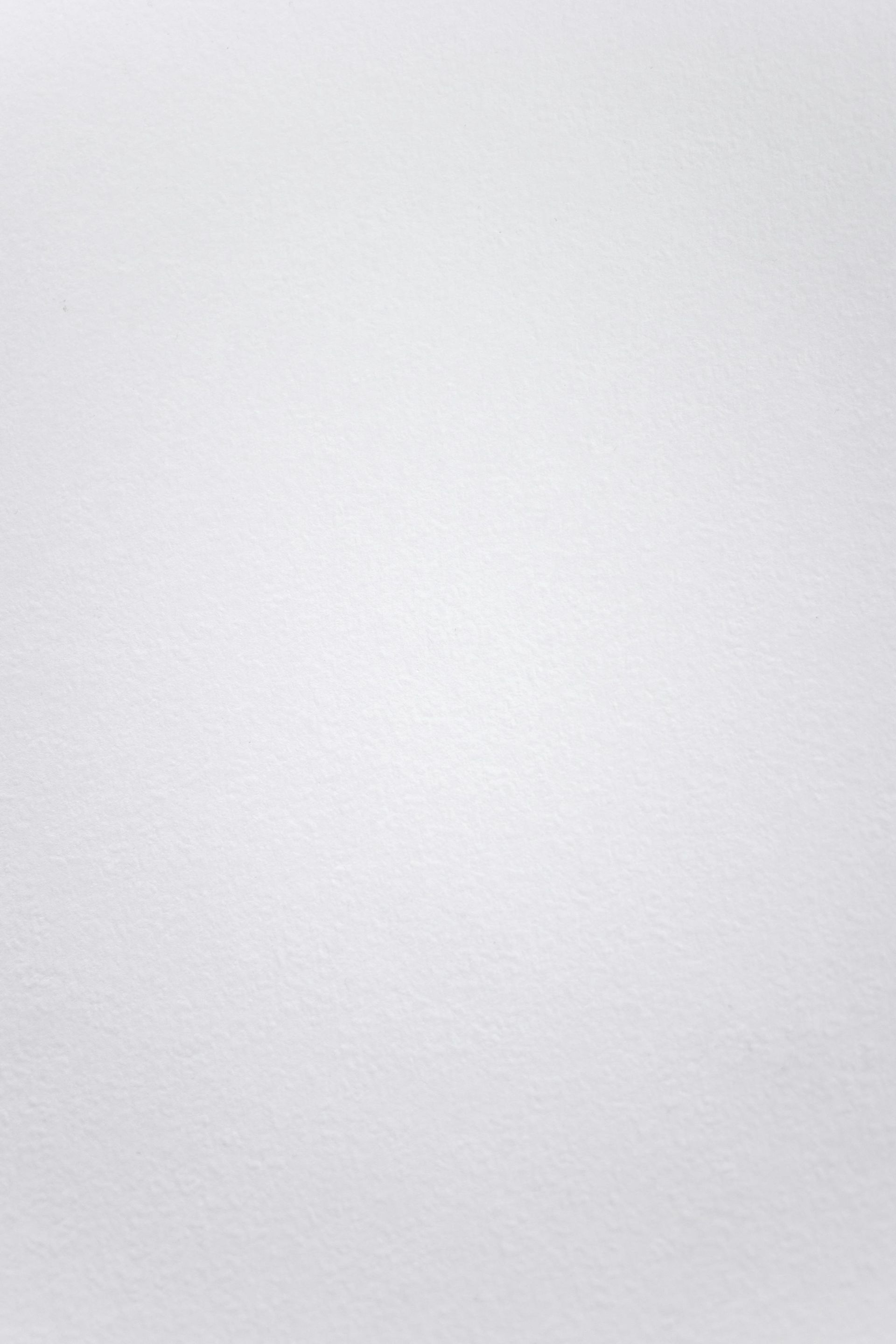 White wall with subtle texture.