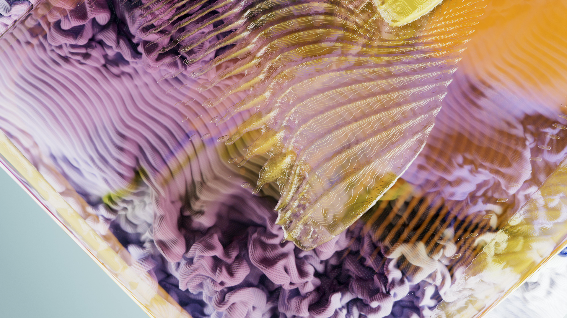 A close up of a purple and orange painting on a table.