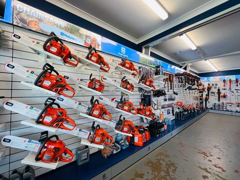 A Store Filled with Lots of Chainsaws on Display — Mid Coast Mowers In Taree, NSW