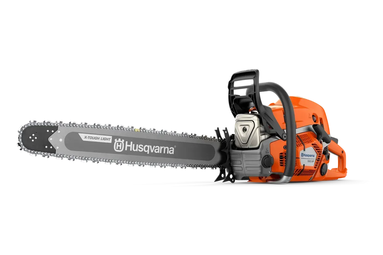 A Husqvarna Chainsaw Is Sitting on A White Surface — Mid Coast Mowers In Taree, NSW
