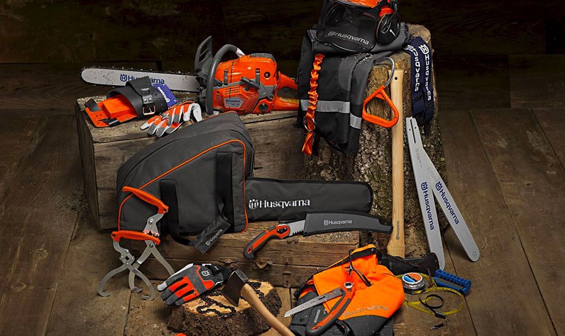 A Bunch of Tools Are Sitting on A Wooden Table — Mid Coast Mowers In Taree, NSW