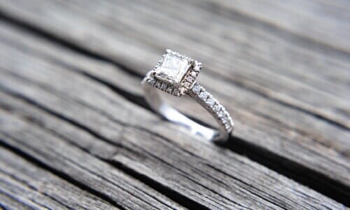 diamond ring on wood — Engagement Rings in Hemet, CA