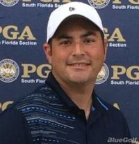 Man wearing a white cap smiles in front of a PGA South Florida Section backdrop.
