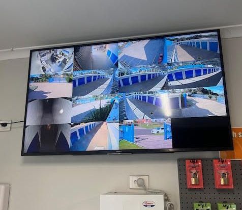 A large flat screen tv is hanging on a wall.