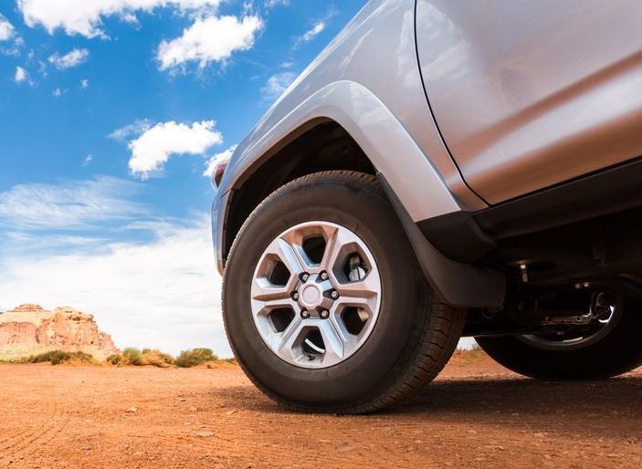 A silver Ute is parked on a dirt road  — Dave's Used Cars In Stuart, NT