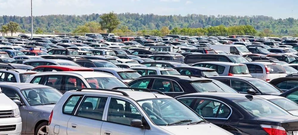 A Lot of Cars Are Parked in a Parking Lot — Dave's Used Cars In Stuart, NT