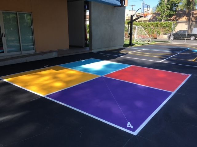 A purple square with the letter a painted on it