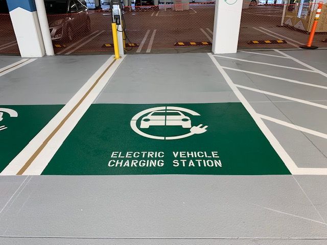 An electric vehicle charging station in a parking garage