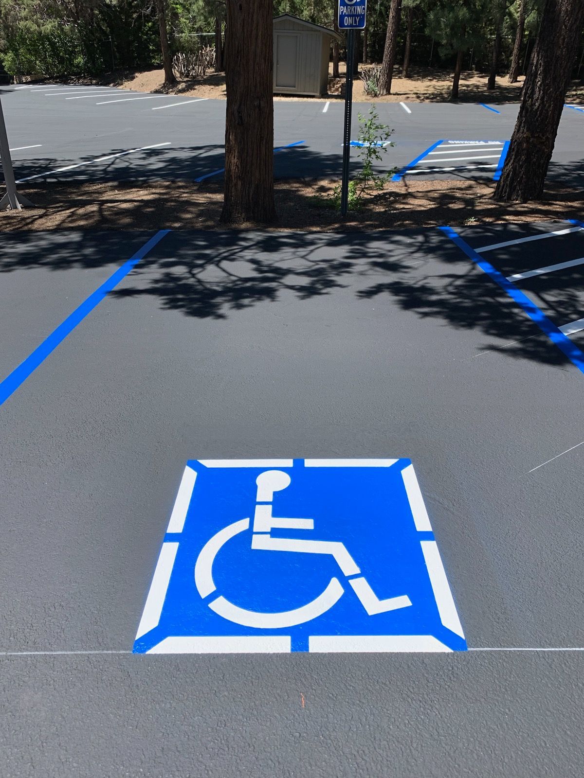 A handicapped parking space with a handicap sign painted on it