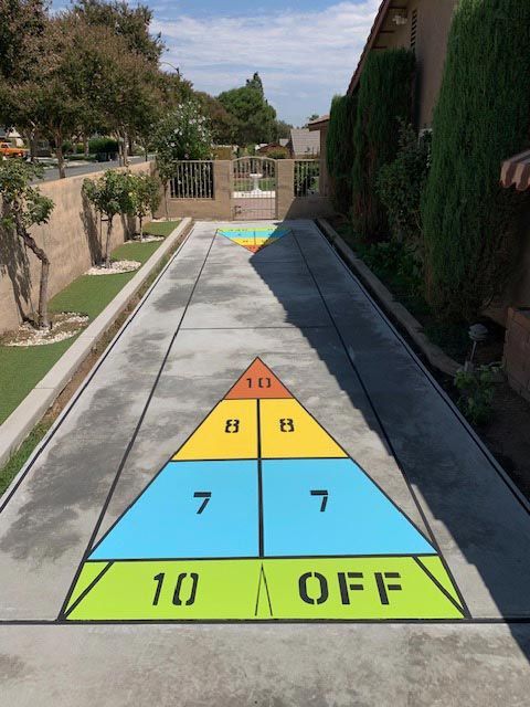 A basketball court with white lines and yellow lines