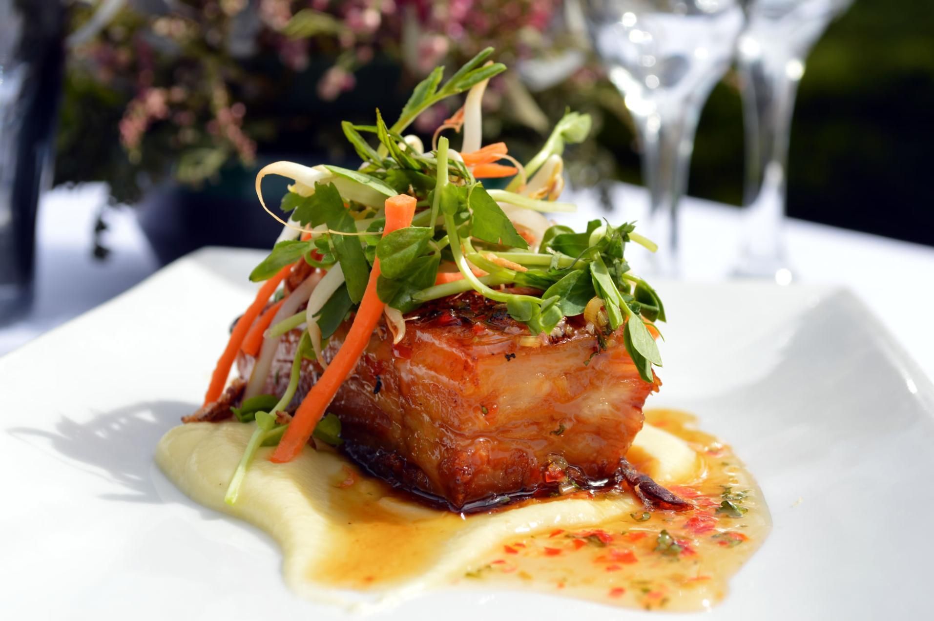 A White Plate Topped With A Piece Of Meat And Vegetables — Top Point Café In East Gosford, NSW