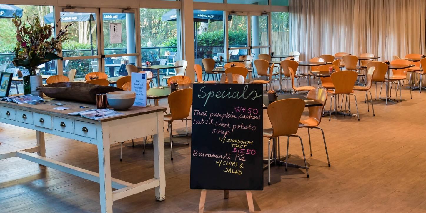 A Restaurant With Tables And Chairs  — Top Point Café In East Gosford, NSW