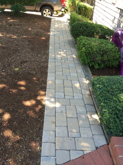 A walkway with a truck parked on the side of it