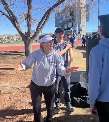 a group of people are running a marathon on a city street .