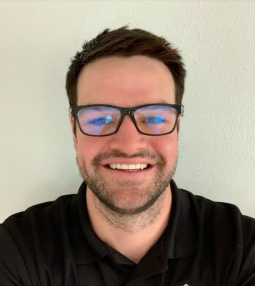 a basketball is going through a basketball hoop with a net