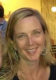 a person is kicking a soccer ball on a field .