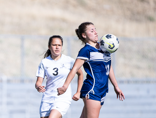 A female soccer player with the number 3 on her jersey
