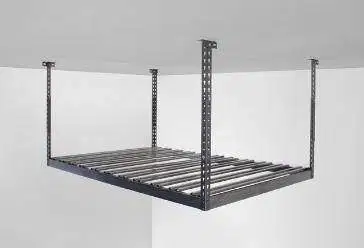 A metal shelf is hanging from the ceiling of a garage.