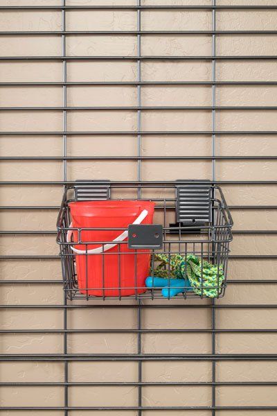 A basket with a bucket and a jump rope in it