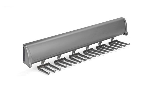 A close up of a tie rack on a white background.