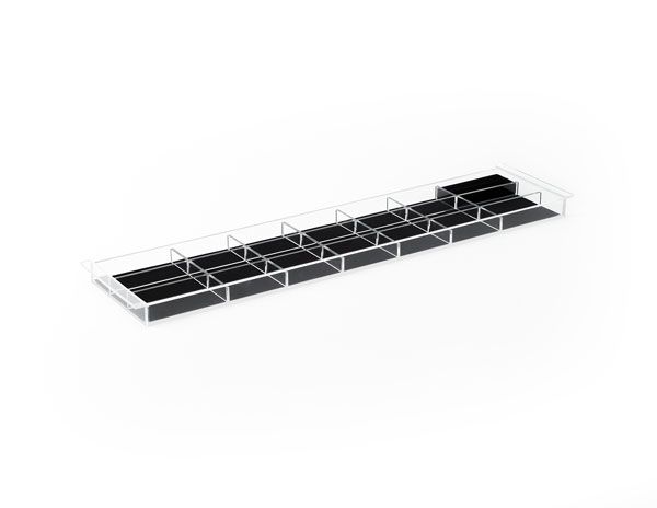 A clear tray with black dividers on a white background.